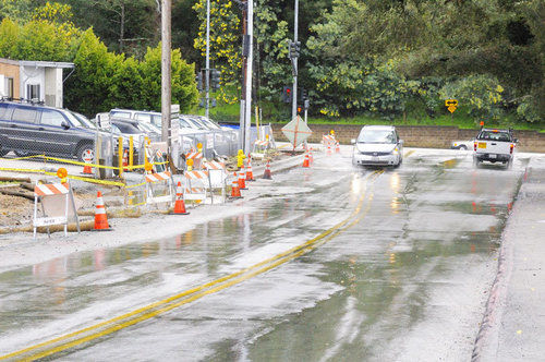 Rain, new sidewalk delay Bean Creek construction