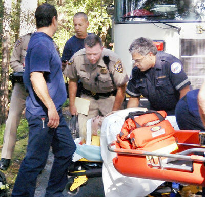 Woman survives car’s 100-foot tumble