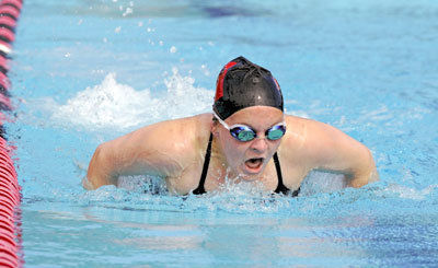 Cougar swimmers win three way meet