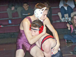 Falcons wrestlers top Cougars in league dual meet.