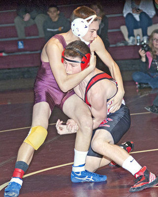 Falcons wrestlers top Cougars in league dual meet.