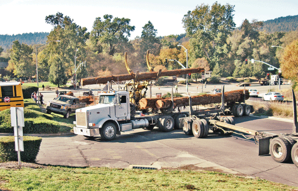 Logging truck overturns in Felton