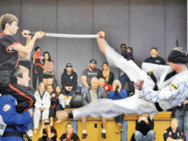 Local martial artists earn black belts