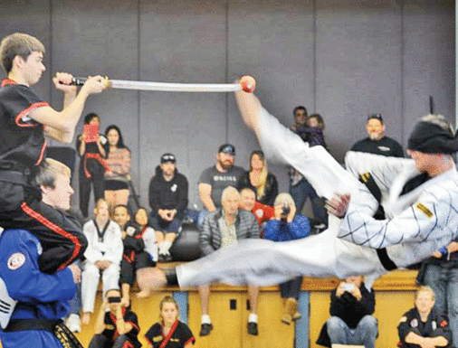 Local martial artists earn black belts