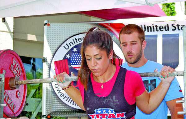 Local weight lifter powers way to national record