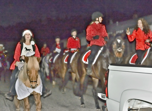 Carolers on horseback spread holiday spirit in downtown Felton