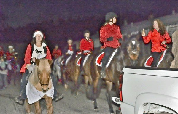 Carolers on horseback spread holiday spirit in downtown Felton