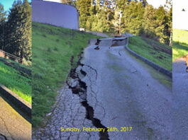 Road near huge water tank washes out