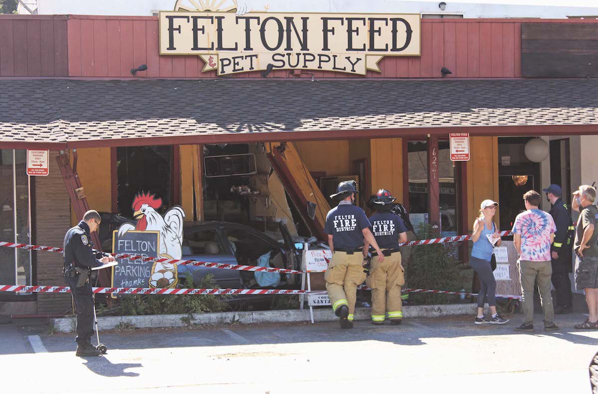 Vehicle plows into Felton Feed Press Banner