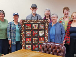 Warm Embrace: Coffee Quilters Wrap Mountain Roasting Owner With Gift Quail Hollow Quilters