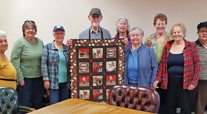 Warm Embrace: Coffee Quilters Wrap Mountain Roasting Owner With Gift Quail Hollow Quilters