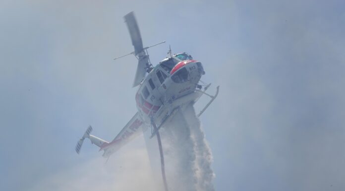 Vista Fire burns 2 acres, 90% contained helicopter dropping water