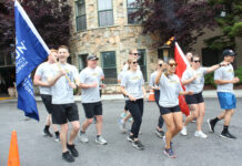 Image for display with article titled Special Olympics flame passes through Scotts Valley