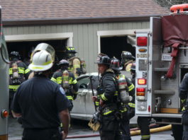 Hidden Oaks Garage Fire Extinguished Quickly holding a tool