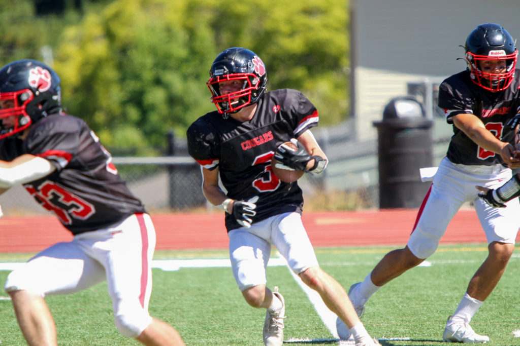 Image for display with article titled Weeklys Sports Ticker: Cougars Football Edges Greenfield in Low Scoring Affair