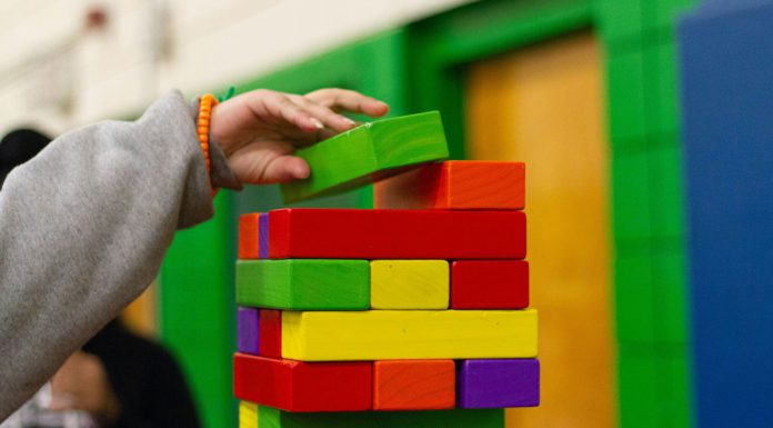 Local collaboration keeps Head Start programs in Santa Cruz County open through October Child piling blocks