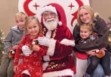 Like clockwork, Santa Claus arrives via firetruck and Holiday Tree is lit in Scotts Valley Family with Santa