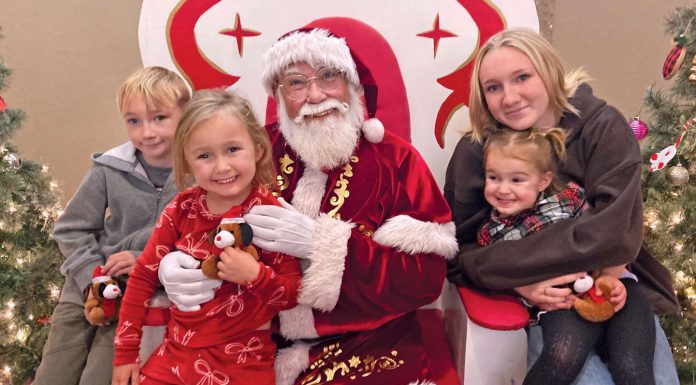 Like clockwork, Santa Claus arrives via firetruck and Holiday Tree is lit in Scotts Valley Family with Santa