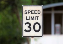 Caltrans sets lower speed limits along Highway 9 speed limit sign post on a roadside close up