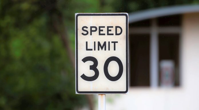 Caltrans sets lower speed limits along Highway 9 speed limit sign post on a roadside close up