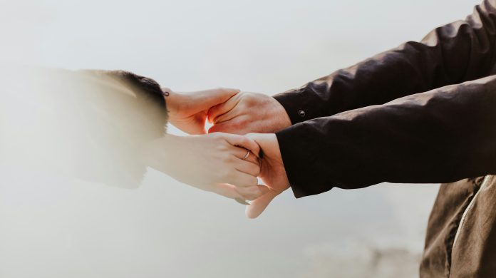 Couple holding hands
