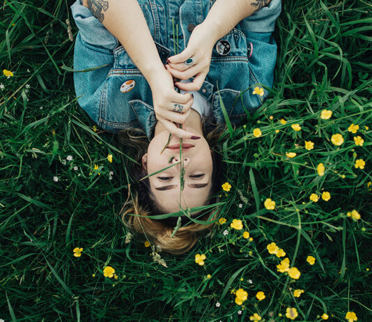 TherapyWorks | Spring Cleaning for Your Mental Health Woman in grass