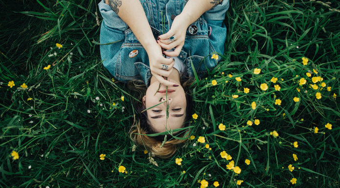 TherapyWorks | Spring Cleaning for Your Mental Health Woman in grass