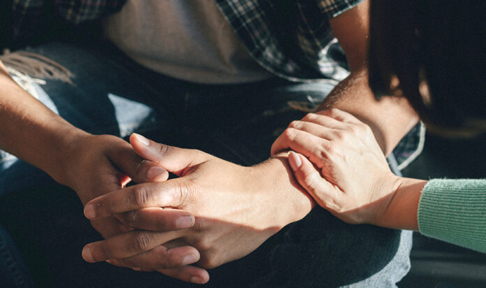 TherapyWorks woman consoling a man AdobeStock_340529279 woman consoling man