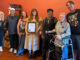 KBCZ marks 10 years on the air with celebration KBCZ staff with plaque