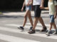 Scotts Valley police launch school safety enforcement Father holding hands with his kids while on pedestrian crossing
