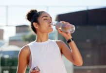 Fitness | Your Body’s Response to Dehydration Woman drinking water hydration