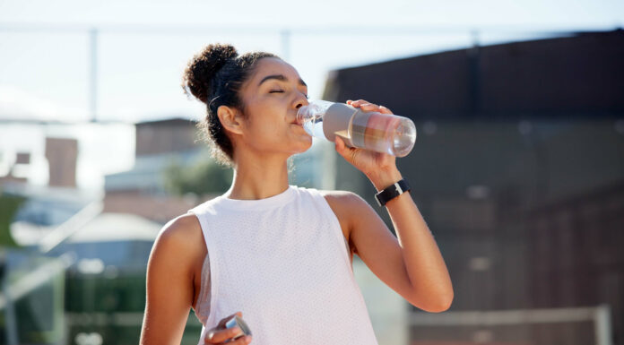 Fitness | Your Body’s Response to Dehydration Woman drinking water hydration
