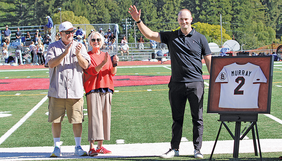 Tanner Murray and jersey with parents